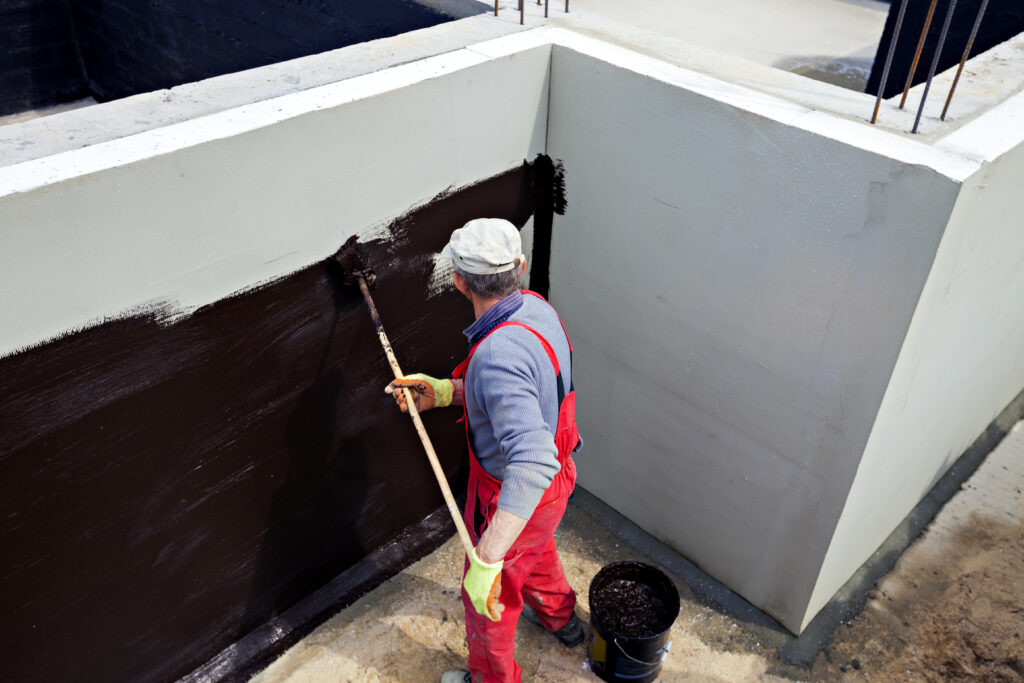 Worker waterproofing below grade